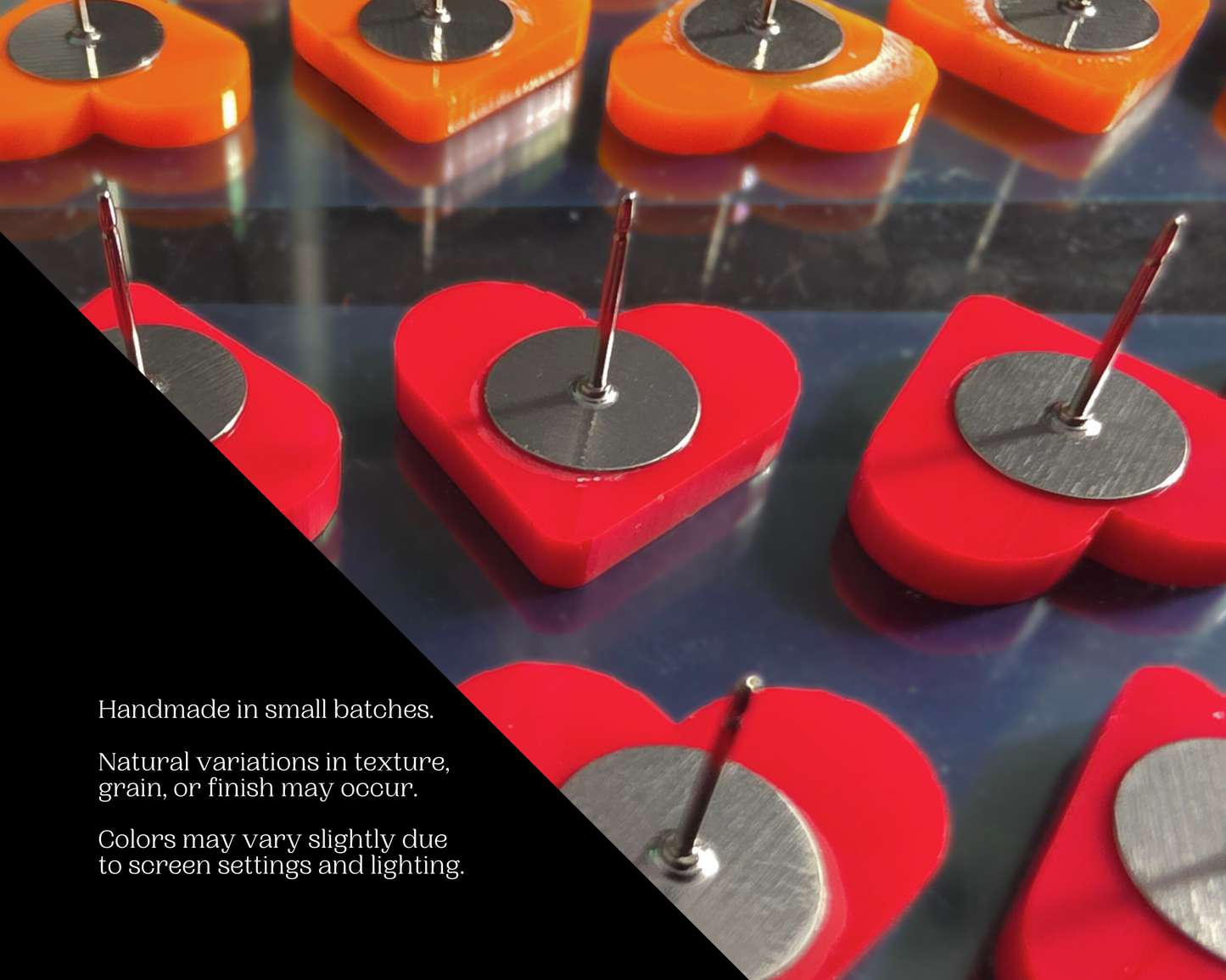Handmade orange and red acrylic heart stud earrings in small-batch production, Rainbow Charlie handmade disclaimer graphic