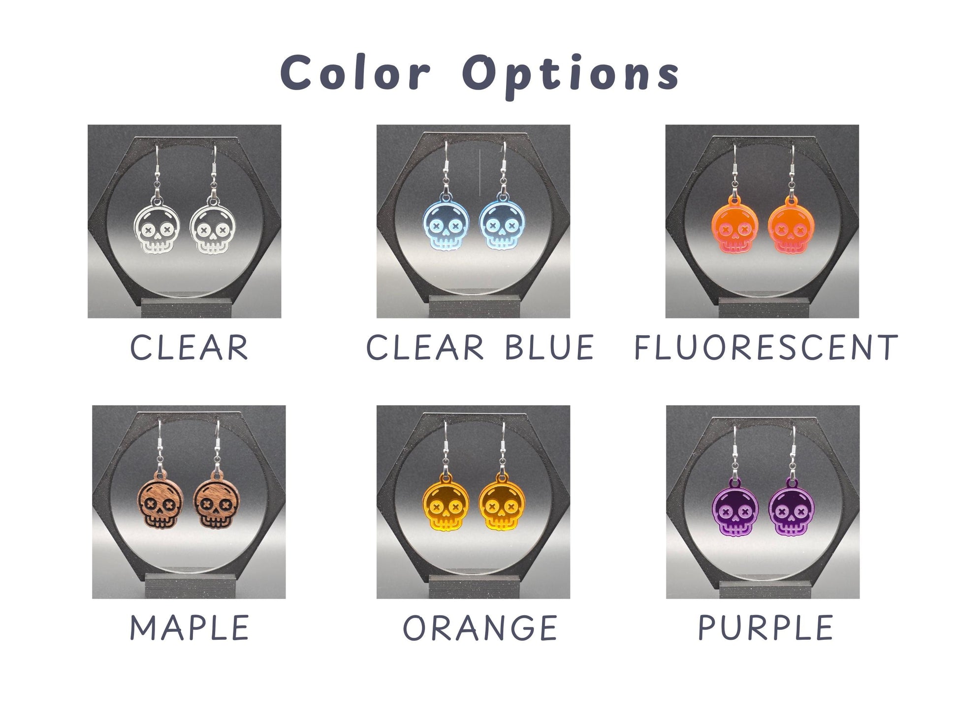 Grid showcasing six available color options for skull earrings: Clear, Clear Blue, Fluorescent, Maple, Orange, and Purple. Each pair is photographed on a black display stand, with legible white labels beneath each to highlight the vibrant and translucent finishes.