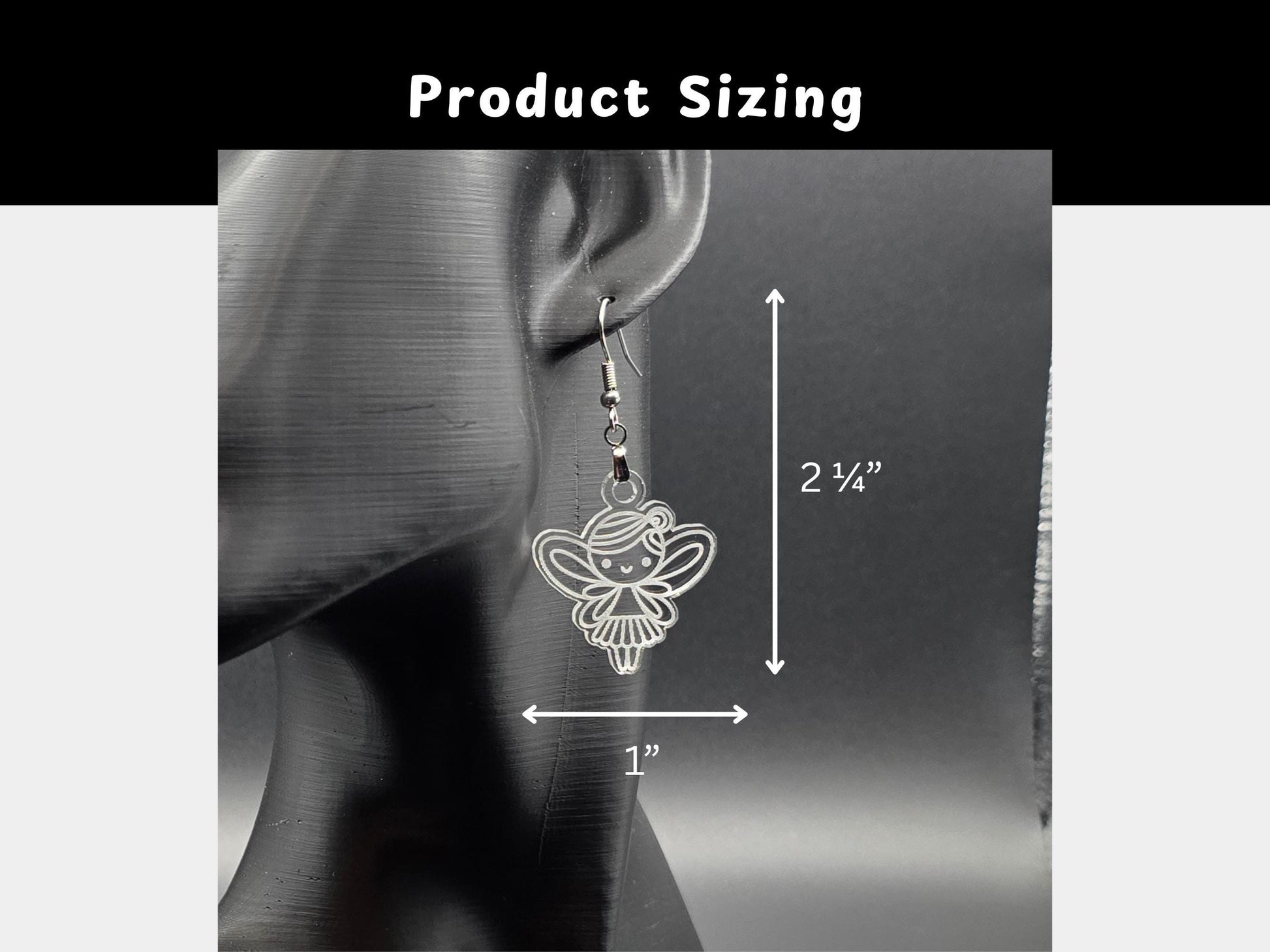 Fairy earring displayed on a mannequin ear with white measurement arrows showing dimensions: 2¼ inches in length and 1 inch in width. Text above reads “Product Sizing.” Background is simple gray for clarity.