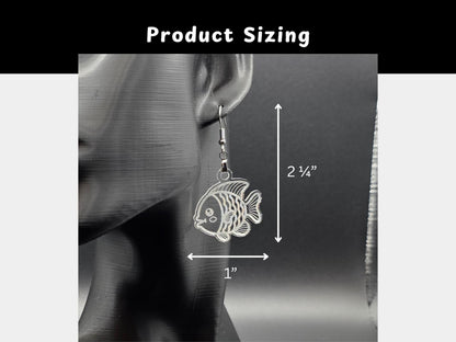 Size guide showing the clear acrylic goldfish earrings hanging on a black mannequin display. Measurement lines indicate the earrings are approximately 2¼ inches long and 1 inch wide.