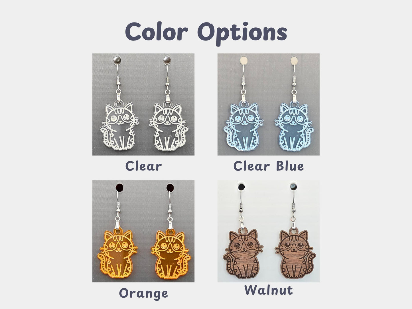 Grid showing four color options of handmade cat earrings: clear acrylic, clear blue acrylic, orange acrylic, and walnut wood. Each pair is displayed on a gray backing card with labels beneath each variation.