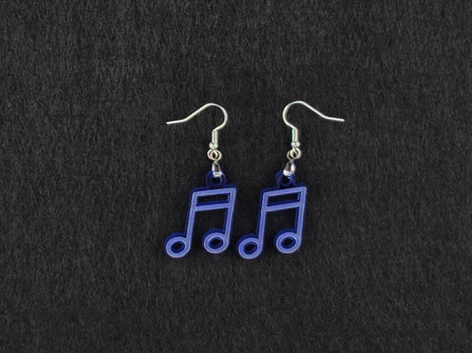 Pair of blue acrylic beam note earrings on stainless steel ear wires, flat lay on a charcoal background.